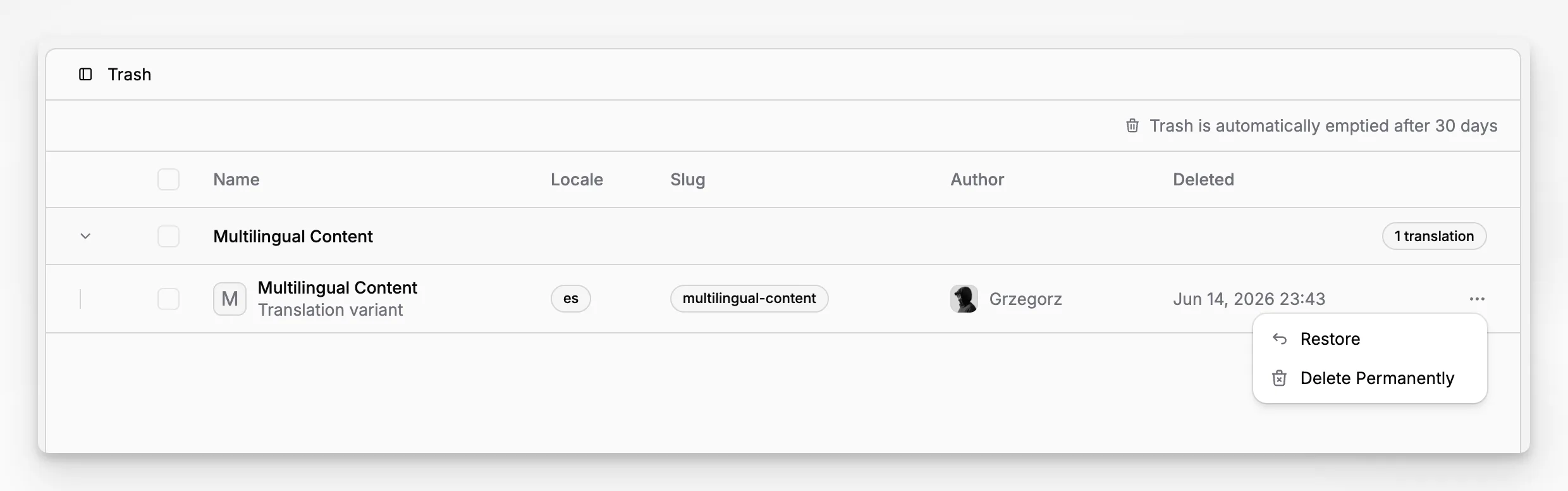 Trash view showing grouped deleted pages with Restore and Delete Permanently actions.